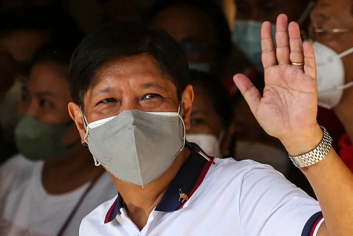 Philippine presidential candidate Ferdinand Marcos Jr waves after casting his vote at Mariano Marcos Memorial Elementary School in Batac, Ilocos Norte on May 9, 2022. (Jam Sta Rosa/AFP via Getty Images)