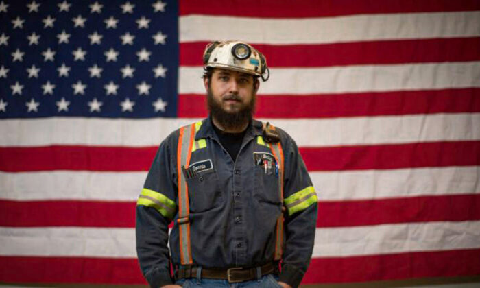 Donnie Claycomb, of Limestone, W.Va., who has been mining for six years, stands in front of an American flag prior to an event with U.S. Environmental Protection Agency Administrator Scott Pruitt at the Harvey Mine in Sycamore, Pa., on April 13, 2017. (Justin Merriman/Getty Images)