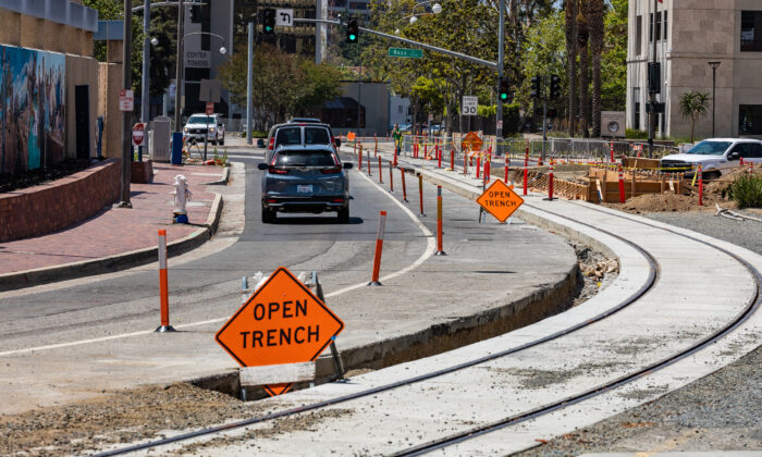 Construction for an upcoming trollycar system is underway in Santa Ana, Calif., on May 4, 2022. (John Fredricks/The Epoch Times)