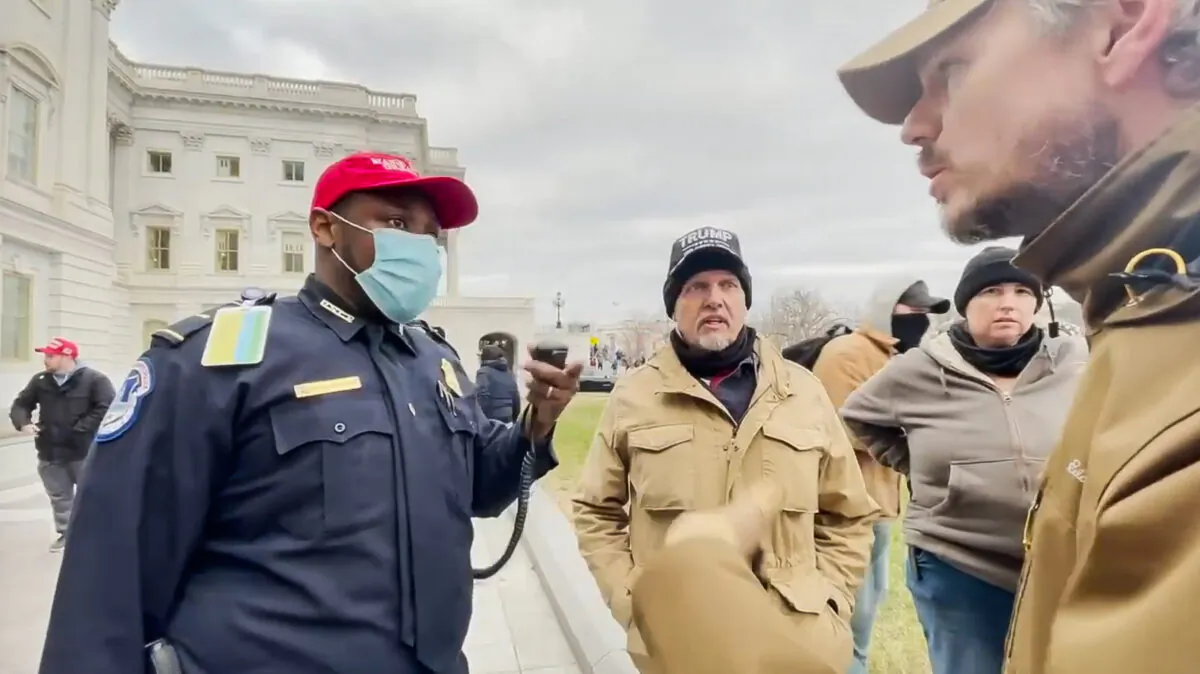 Capitol Police Lt. Tarik Khalid Johnson asks for help from two members of the Oath Keepers to rescue his colleagues trapped in the Capitol on Jan. 6, 2021. (Rico La Starza, Archive.org/Screenshot via The Epoch Times)