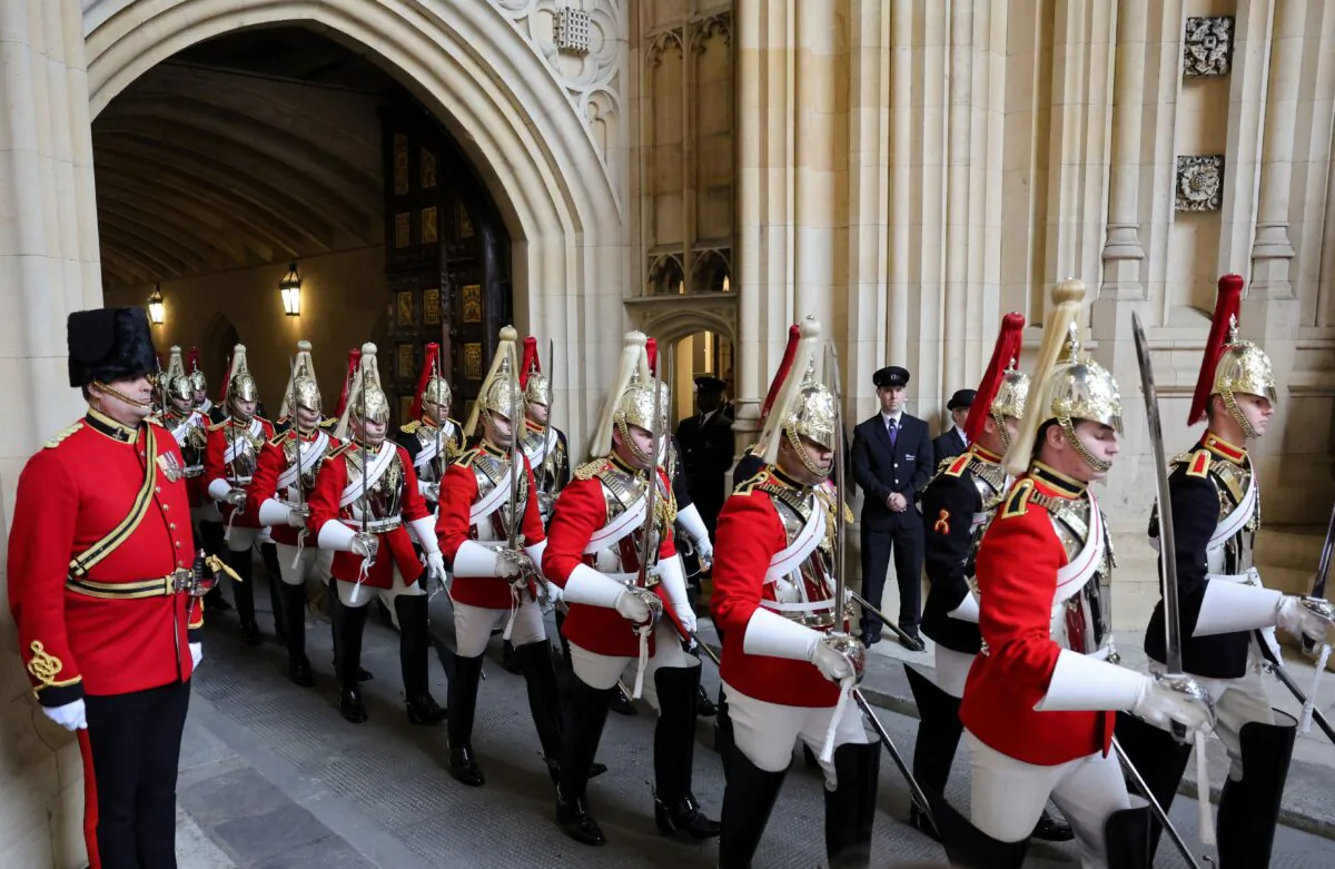 Members of the Household Cavalry arrive through the Sovereign's Entrance ahead of the State Opening of Parliament at the Houses of Parliament in London, on May 10, 2022. (Chris Jackson/POOL/AFP via Getty Images)