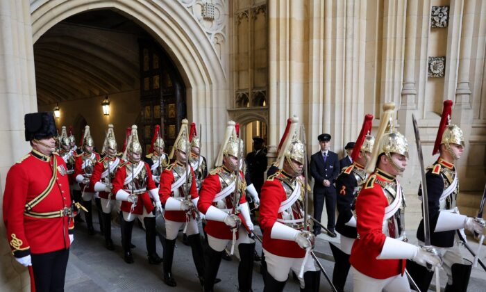 Members of the Household Cavalry arrive through the Sovereign's Entrance ahead of the State Opening of Parliament at the Houses of Parliament in London, on May 10, 2022. (Chris Jackson/POOL/AFP via Getty Images)