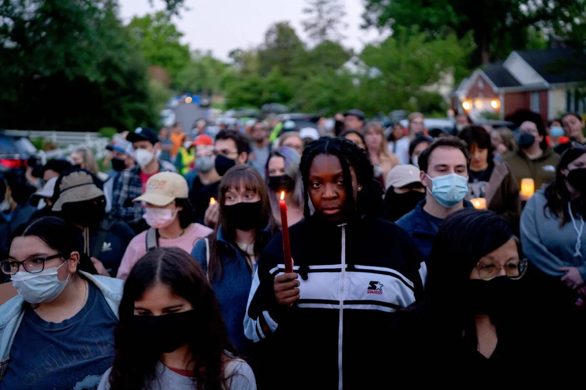 Demonstrators gather outside the home of Supreme Court Justice Samuel Alito in Alexandria, Va., on May 9, 2022. (Stefani Reynolds/AFP via Getty Images)
