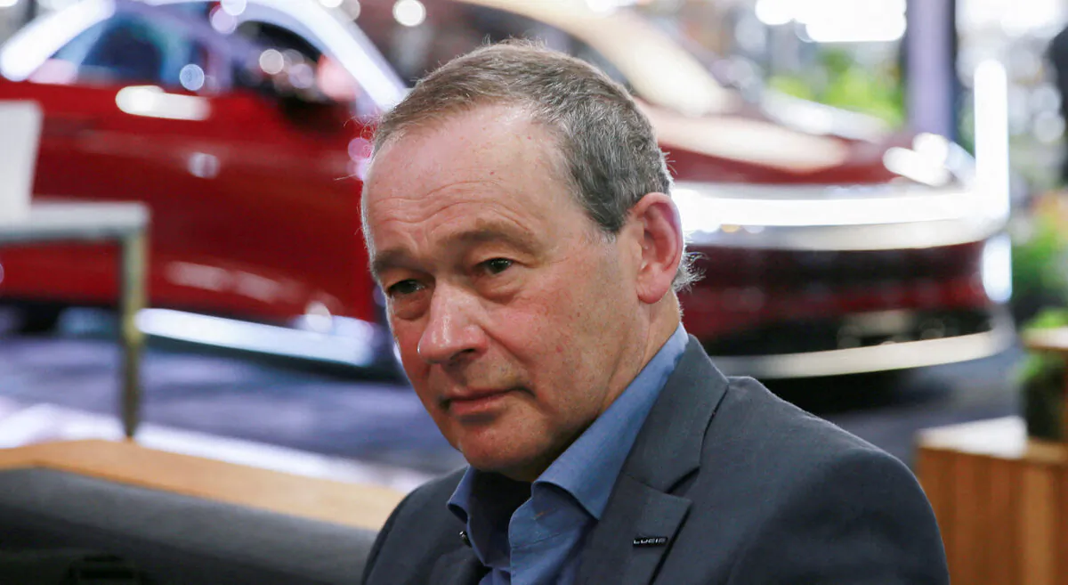 FILE PHOTO: CEO Peter Rawlinson speaks with a reporter at the Lucid Motors plant in Casa Grande, Arizona, U.S. September 28, 2021.  REUTERS/Caitlin O'Hara