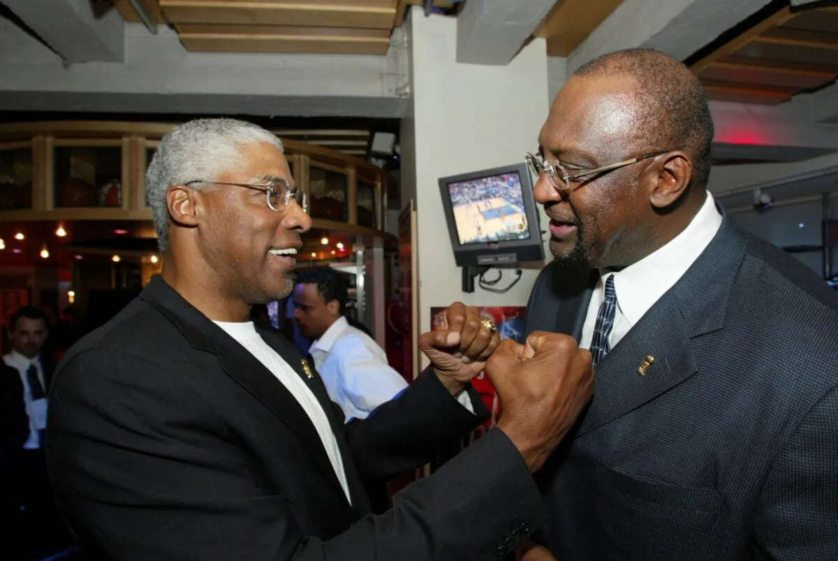 NBA legend Julius 'Dr. J' Erving greets former Milwaukee Bucks' Bob Lanier (R) during LeBron James presentation for the NBA Rookie of the Year award at the NBA Store on New York's 5th Avenue on April 20, 2004. (Stuart Ramson/AP Photo)