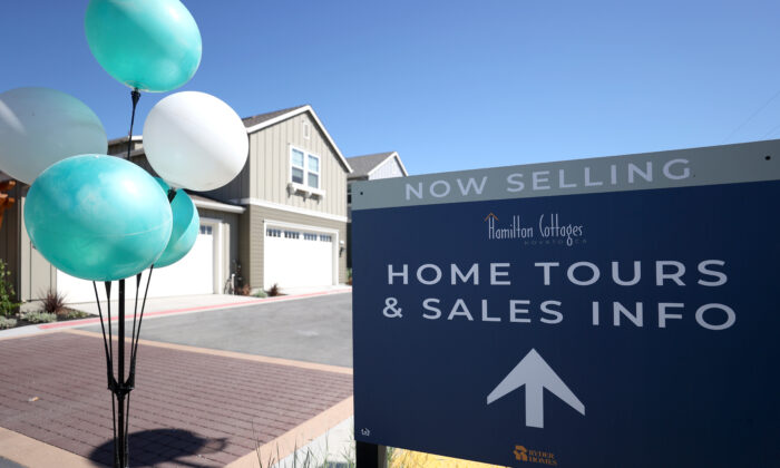 A sign is posted in front of new homes for sale at Hamilton Cottages in Novato, Calif., on Sept. 24, 2020. (Justin Sullivan/Getty Images)