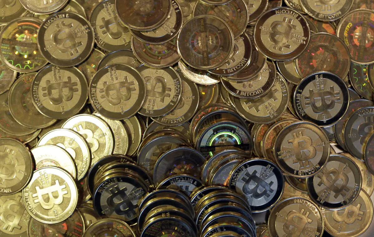The file photo shows bitcoin tokens in Sandy, Utah on April 3, 2013. (Rick Bowmer/AP Photo)
