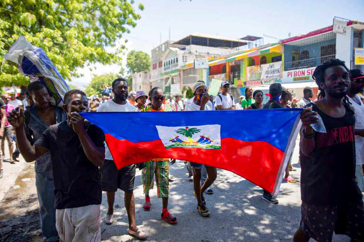 Demonstrators march demanding peace and security in La Plaine neighborhood of Port-au-Prince, Haiti, on May 6, 2022. (Odelyn Joseph/AP Photo)