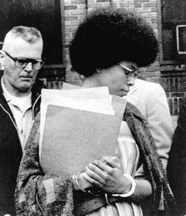 FILE — Joanne Chesimard, a member of the Black Panther Party and Black Liberation Army, leaves Middlesex County courthouse, in New Brunswick, N.J., April 25, 1977. A split New Jersey Supreme Court granted parole Tuesday, May 10. 2022, to Sundiata Acoli, a former militant convicted in the 1973 death of a New Jersey state trooper, in a case that has resonated for decades and been a thorny issue in U.S.-Cuba relations. Acoli's more-famous co-defendant, Chesimard, also was convicted and sentenced to a life term but escaped from a New Jersey prison in 1979. She was given asylum in Cuba by then-President Fidel Castro and remains a fugitive. (AP Photo, File)