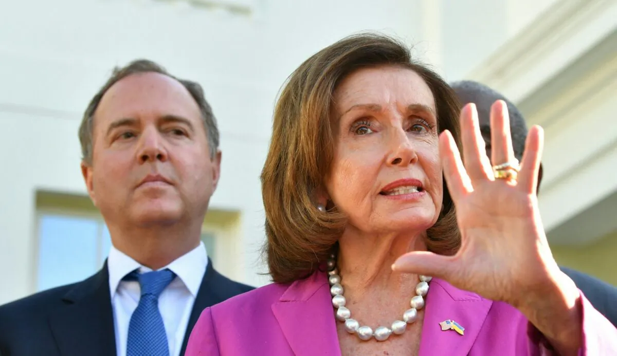 Rep. Adam Schiff (D-Calif.) listens as House Speaker Nancy Pelosi (D-Calif.), alongside members of the Congressional delegation that recently visited Ukraine, speaks to reporters following a meeting with President Joe Biden at the White House in Washington, on May 10, 2022. (Nicholas Kamm/AFP via Getty Images)