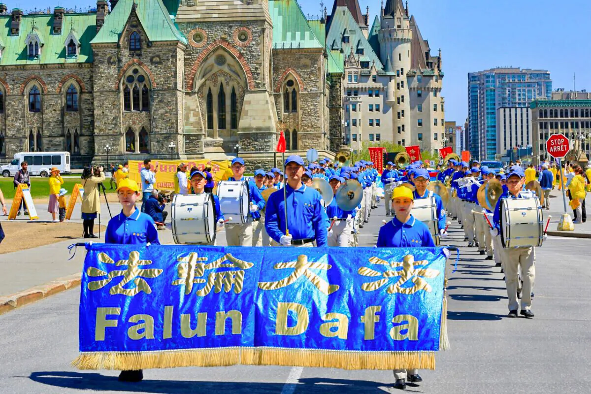 The Tian Guo Marching Band takes part in a parade in Ottawa as Falun Gong adherents celebrated the 30th anniversary of the spread of the spiritual practice, on May 10, 2022. (Jonathan Ren/The Epoch Times)
