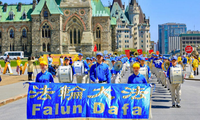 The Tian Guo Marching Band takes part in a parade in Ottawa as Falun Gong adherents celebrated the 30th anniversary of the spread of the spiritual practice, on May 10, 2022. (Jonathan Ren/The Epoch Times)