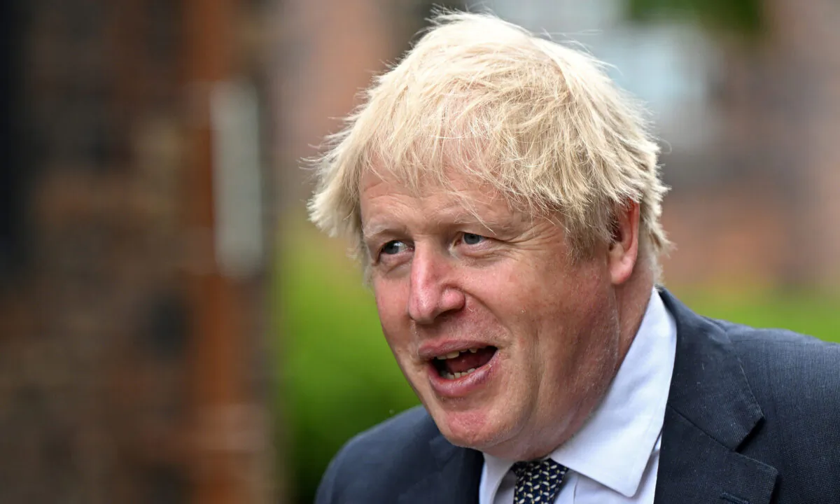 Prime Minister Boris Johnson arrives for a regional cabinet meeting at Middleport Pottery in Stoke on Trent, Staffordshire, England, on May 12, 2022. (Oli Scarff/PA)