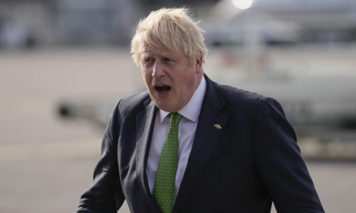 British Prime Minister Boris Johnson gets off the plane after landing in Helsinki, Finland, on May 11, 2022. (Frank Augstein/PA)