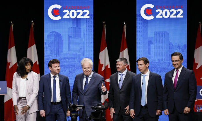 Conservative Party leadership candidates pose on stage following the Conservative Party of Canada English leadership debate in Edmonton on May 11, 2022. (The Canadian Press/Jeff McIntosh)