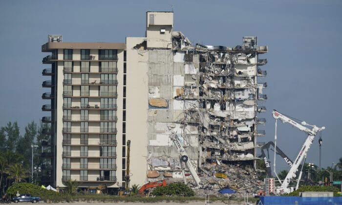 Coast Guard boats patrol in front of the partially collapsed Champlain Towers South condo building, in Surfside, Fla. on July 1, 2021. (Mark Humphrey/AP Photo)