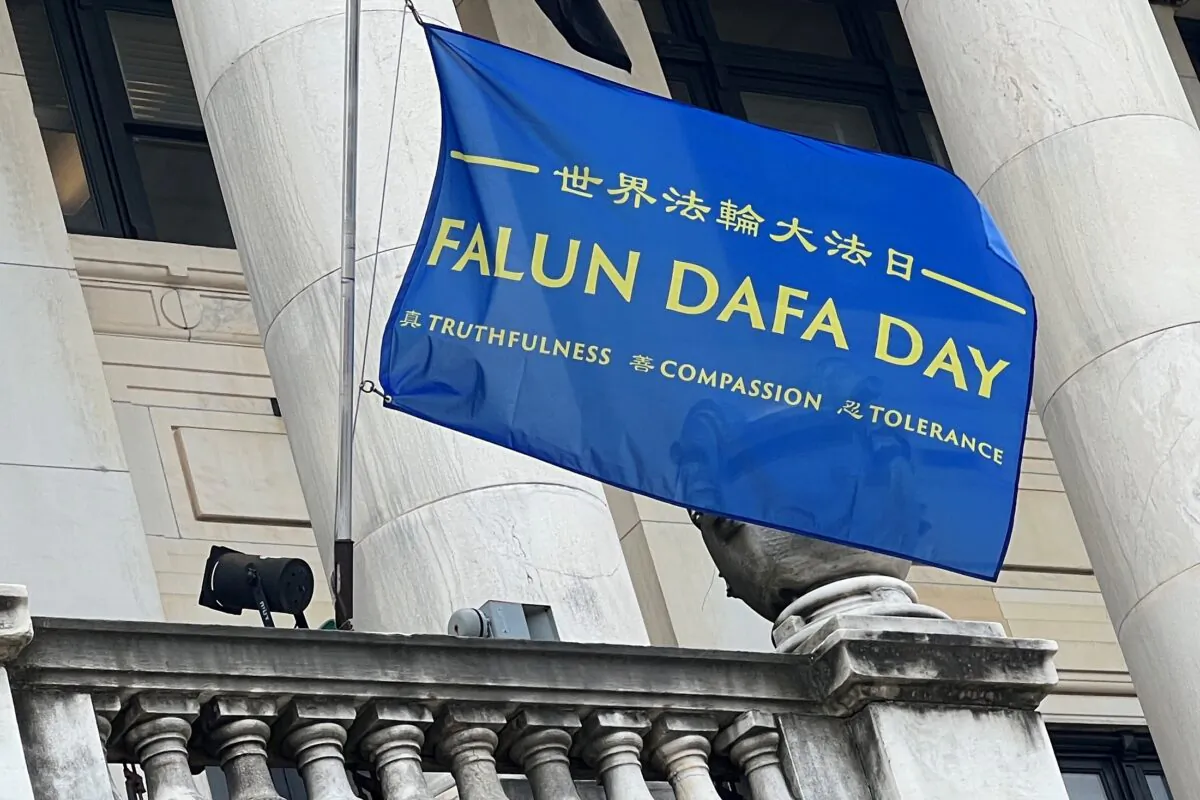 Celebrating the 30th anniversary of the introduction of Falun Dafa, a Falun Dafa Day flag was raised on the city hall of New Jersey's capital Trenton on May 12, 2022. (Pei Yu/Epoch Times)
