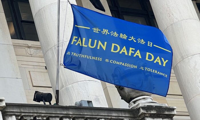 Celebrating the 30th anniversary of the introduction of Falun Dafa, a Falun Dafa Day flag was raised on the city hall of New Jersey's capital Trenton on May 12, 2022. (Pei Yu/Epoch Times)