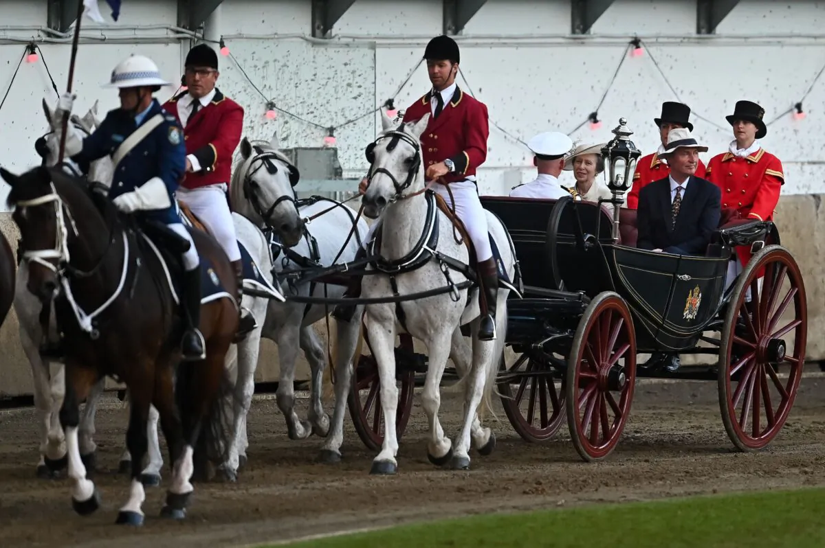 Britain's Princess Anne and Vice Admiral Timothy Laurence ride in a horse-drawn carriage during the opening ceremony of the Royal Easter Show in Sydney on April 9, 2022. (Steven Saphore / AFP) (Photo by STEVEN SAPHORE/AFP via Getty Images)