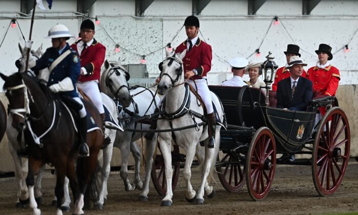 Britain's Princess Anne and Vice Admiral Timothy Laurence ride in a horse-drawn carriage during the opening ceremony of the Royal Easter Show in Sydney on April 9, 2022. (Steven Saphore / AFP) (Photo by STEVEN SAPHORE/AFP via Getty Images)