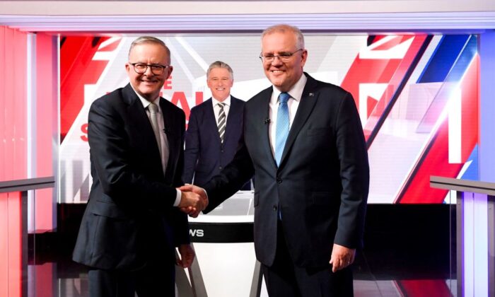 Australian Prime Minister Scott Morrison (R) and leader of the opposition, Anthony Albanese shake hands at the final leaders' debate of the 2022 at Seven Network Studios in Sydney, Australia on May 11, 2022. (Lukas Coch/POOL/AFP via Getty Images)