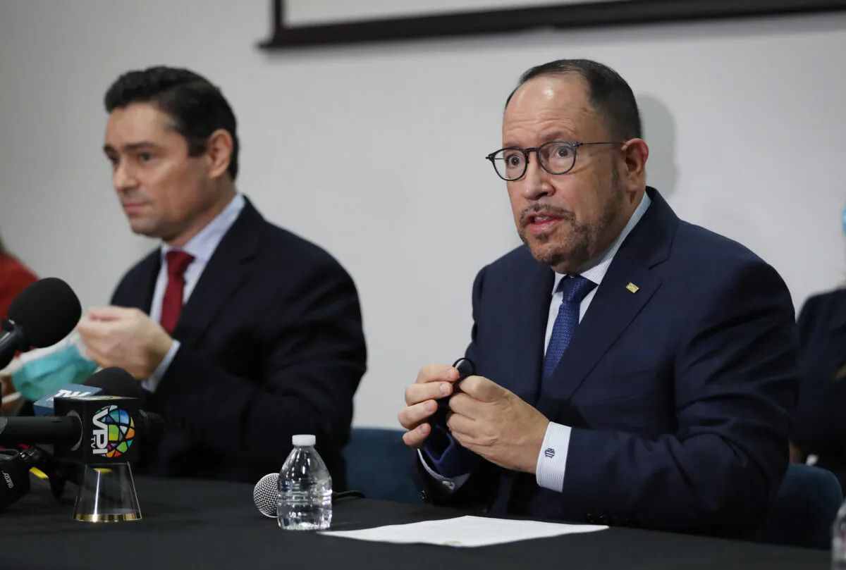 (L-R) Carlos Vecchio, the Venezuelan Ambassador who's recognized by the United States, and Goya Foods President Robert Unanue hold a press conference together on Dec. 21, 2020, in Doral, Fla. The two held the press conference to discuss details of a recent shipment of humanitarian aid to Venezuela, donated by Goya Foods. (Joe Raedle/Getty Images)