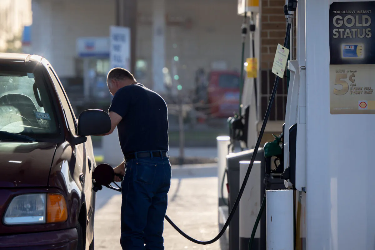 A man pumps gas at a Shell gas station in Houston, Texas on April 1, 2022. (Brandon Bell/Getty Images)