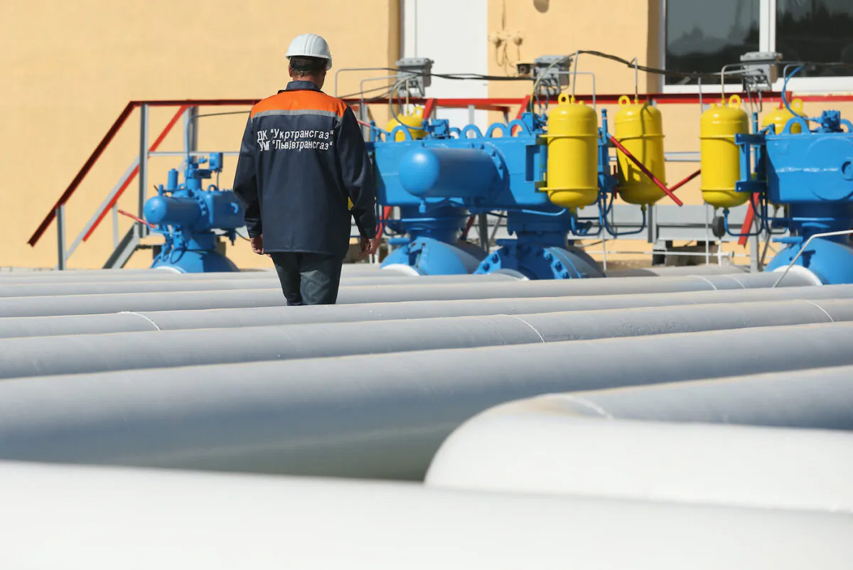 A worker walks among pipes at the Dashava natural gas facility in Dashava, Ukraine on Sept. 18, 2014. (Sean Gallup/Getty Images)