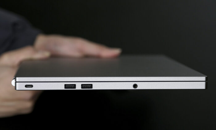 A photo shows, from left, the USB Type-C port, two standard USB ports, and headphone jack on a laptop, in San Jose, Calif., on March 10, 2015. (Jeff Chiu/AP Photo)