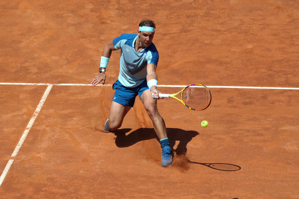Rafael Nadal of Spain comes in to the net against John Isner of the United States in their 2nd Round Singles match on day three of the Internazionali BNL D'Italia at Foro Italico in Rome on May 11, 2022. (Paolo Bruno/Getty Images)