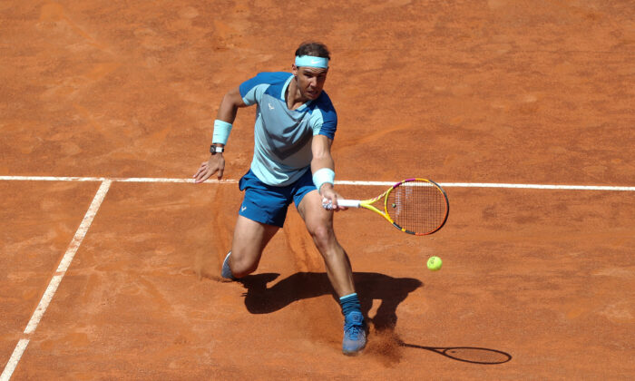 Rafael Nadal of Spain comes in to the net against John Isner of the United States in their 2nd Round Singles match on day three of the Internazionali BNL D'Italia at Foro Italico in Rome on May 11, 2022. (Paolo Bruno/Getty Images)