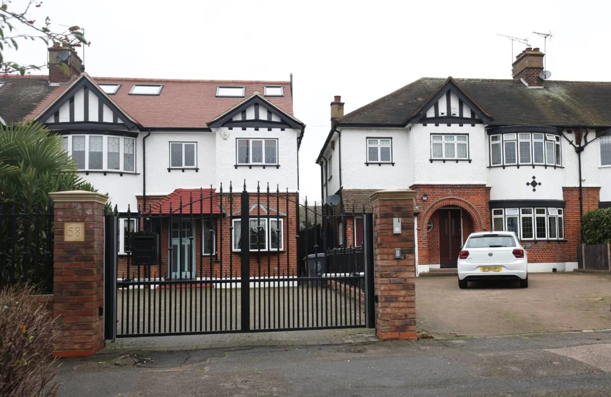 Two neighbouring houses in Chingford, northeast London, on Dec. 30, 2021. (PA Media)