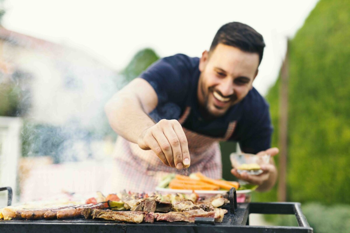 Steak welcomes the flavor of hardwood charcoal and high heat. (Jelena Zelen/Shutterstock)