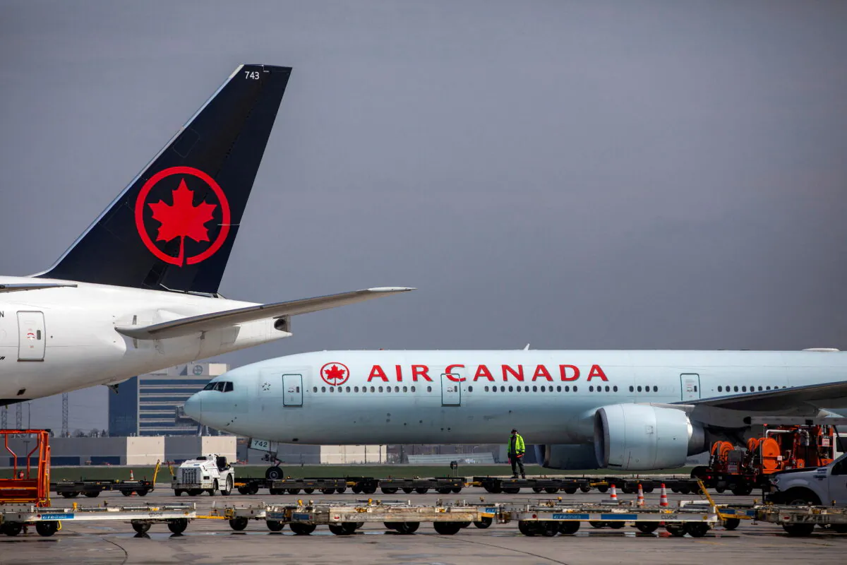 Air Canada planes are parked at Toronto Pearson Airport in Mississauga, Ontario, on April 28, 2021. (Carlos Osorio/Reuters)