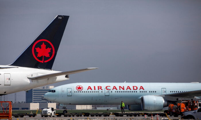 Air Canada planes are parked at Toronto Pearson Airport in Mississauga, Ontario, on April 28, 2021. (Carlos Osorio/Reuters)