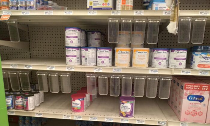 The shelves at a Marc's grocery store, which has started rationing cans of powdered baby formula, in the west Cleveland suburb of Lakewood, Ohio, on May 13, 2022. Customers are limited to three 12.5-ounce cans of Enfamil during the shortage that has been caused by a recall of other brands produced by Abbott Labs in Michigan. (Michael Sakal/The Epoch Times)
