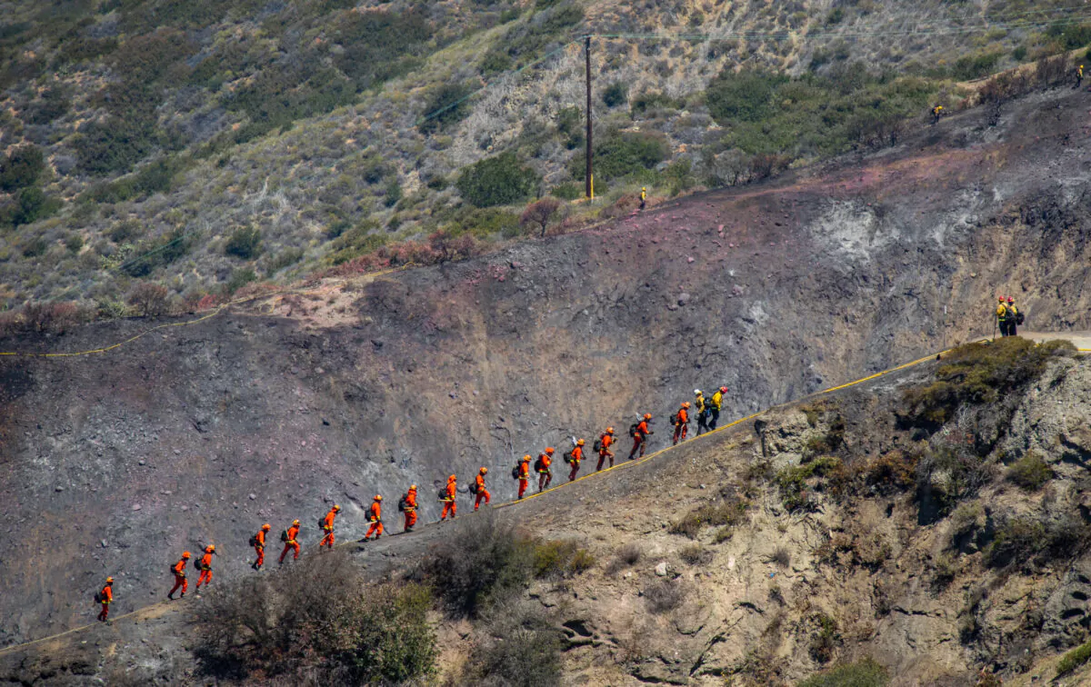First-Responders continue their efforts in containment of the Coastal Fire as teams work through the debris of the destruction of the Coronado Pointe neighborhood of Laguna Niguel, Calif., on May. 13, 2022. (John Fredricks/The Epoch Times)