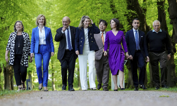 (L-R) Victoria Nuland, Under Secretary of State and Political Director at the U.S. Department of State, Elizabeth Truss, Foreign Minister of the United Kingdom, Jean-Yves Le Drian, Foreign Minister of France, Melanie Joly, Foreign Minister of Canada, Hayashi Yoshimasa, Foreign Minister of Japan, Annalena Baerbock, Luigi Di Maio, Foreign Minister of Italy, and Josep Borrell, High Representative of the EU for Foreign Affairs and Security Policy, walk at the summit of foreign ministers of the G-7 group of leading democratic economic powers, in Weissenhäuser Strand,  Germany, on May 12, 2022. (Marcus Brandt/pool photo via AP)