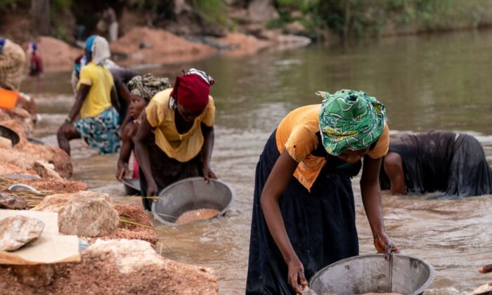 Artisanal miners collect gravel from the Lukushi river searching for cassiterite in Manono, the Democratic Republic of Congo on Feb.17, 2022.
(Junior Kannah/AFP via Getty Images)