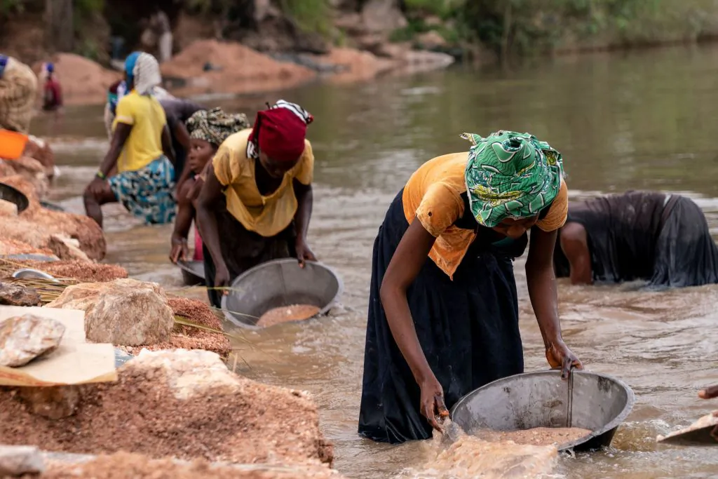 Artisanal miners collect gravel from the Lukushi River, searching for cassiterite in Manono, the Democratic Republic of Congo on Feb.17, 2022.
(Junior Kannah/AFP via Getty Images)