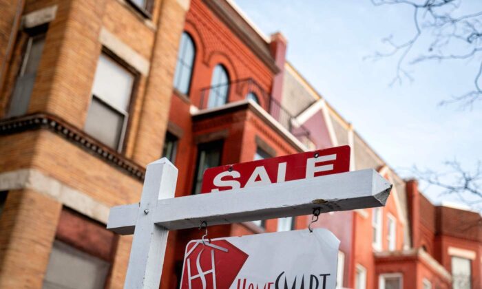 A for sale sign is displayed in front of a house in Washington, D.C., on March 14, 2022. (Stefani Reynolds/AFP via Getty Images)