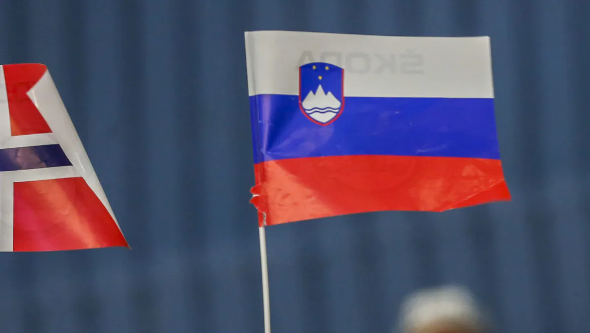 A girl waves with Slovene flag during the IIHF World Championship group B match between Slovenia and Norway at CEZ Arena on May 8, 2015 in Ostrava, Czech Republic. (Matej Divizna/Getty Images)