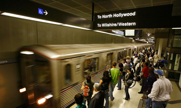 Passengers wait for Metro Rail subway trains during rush hour in Los Angeles on June 3, 2008. (David McNew/Getty Images)
