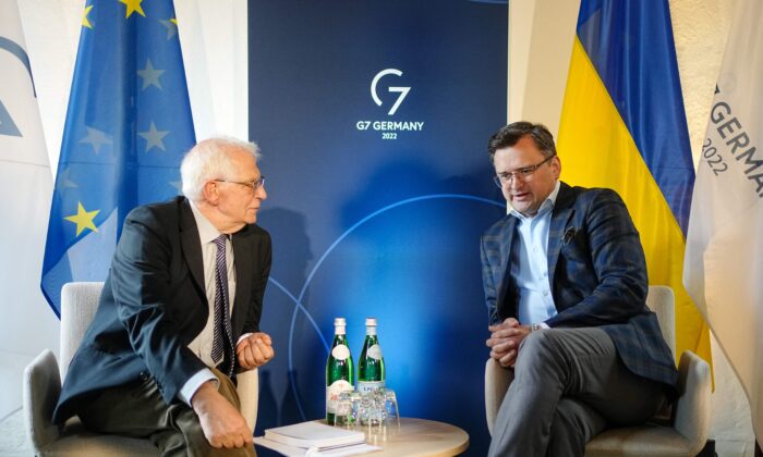 The High Representative of the European Union for Foreign Affairs and Security Policy Josep Borrell (L) and Ukraine's Foreign Minister Dmytro Kuleba talk during a bilateral meeting at the G7 Foreign Ministers meeting in Wangels, northern Germany, on May 13, 2022. (Kay Nietfeld/Pool/AFP via Getty Images)