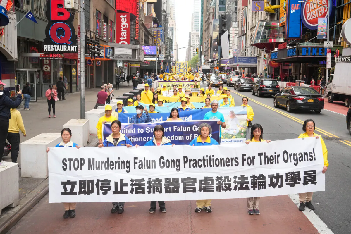 Falun Gong practitioners take part in a parade marking the 30th anniversary since its introduction to the public, in Manhantan, New York City, on May 13, 2022. (Larry Dye/The Epoch Times)