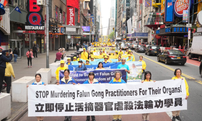 Falun Gong practitioners take part in a parade marking the 30th anniversary since its introduction to the public, in Manhantan, New York City, on May 13, 2022. (Larry Dye/The Epoch Times)