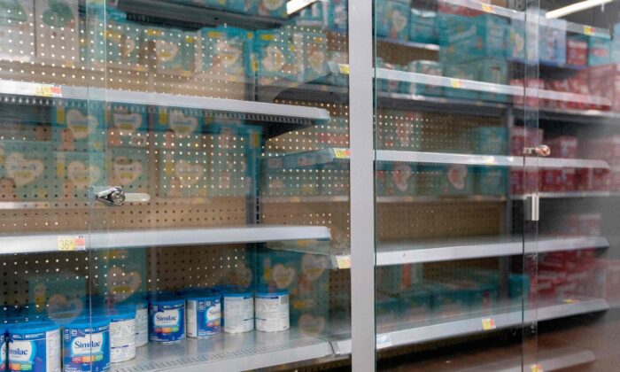 Grocery store shelves where baby formula is typically stocked are locked and nearly empty in Washington on May 11, 2022. (Stefani Reynolds/AFP via Getty Images)