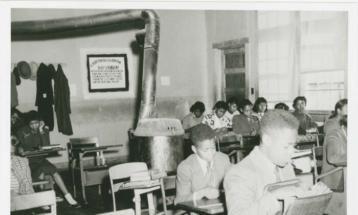 A 1951 photograph of Miss West's English 9 Class at R. R. Moton High School. It was used as Defendant's Exhibit No. 60, in the civil rights case Dorothy E. Davis et al. v. County School Board of Prince Edward County, Virginia, to show a comparison of conditions between black and white schools. This was one of five cases that were decided in Brown Vs. Board of Education.  (National Archives) 