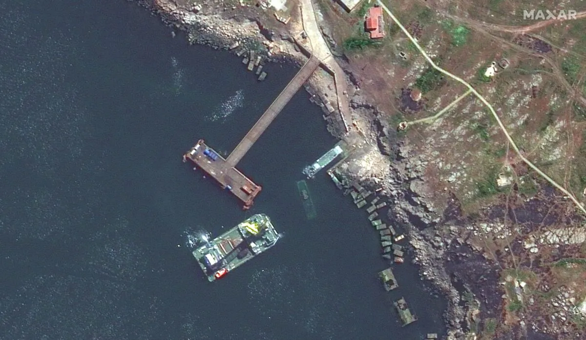 Satellite image showing barge, serna class landing craft, and sunken serna craft off the coast of Snake Island, Ukraine, on May 13, 2022. (Maxar Technologies via AP)