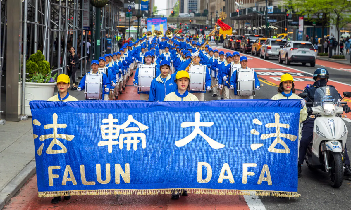 Falun Gong practitioners take part in a parade marking the 30th anniversary since its introduction to the public, in Manhattan, New York City, on May 13, 2022. (Mark Zou/The Epoch Times)